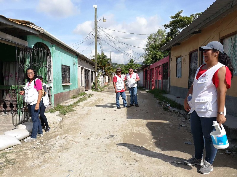 Group of volunteers conduct surveys in the street