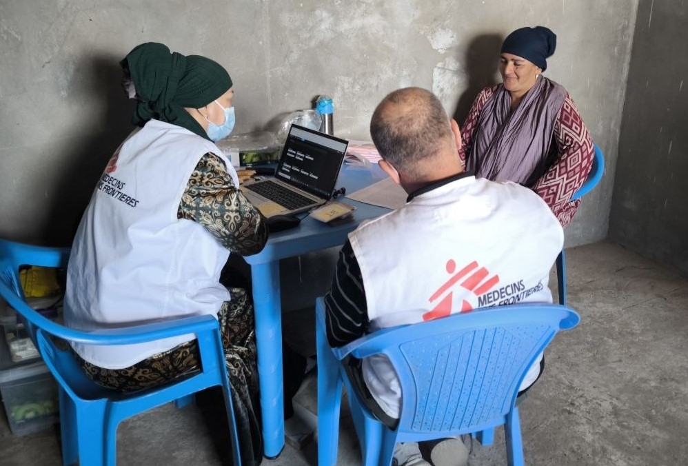 Fig x An MSF nurse is registering a villager who came for screening to a temporary X-ray facility set up by the project staff in Zarbdor village, Kulob, Tajikistan. (c) Kamola Rasulova/MSF  